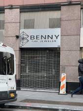 Benny the Jeweler’s Diamond District pop-up shop on December 8, a day after it was successfully robbed for $1 million. Two suspects who sped off in a black Mercedes sedan are being sought by authorities.