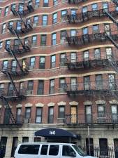 A visit to a famed co-op building at 160 E. 91st St., the day after a three-alarm blaze tore through multiple floors, revealed minimal exterior damage. A total of 20 units were evacuated, however.