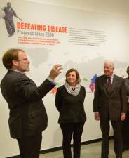 President Ellen Futter of the American Museum of Natural History (center) with former President Jimmy Carter, at the 2015 AMNH exhibition from the Carter Center. (Photo: American Museum of Natural History)