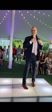 NYC Borough President Mark Levine walking the ramp for “Style across the Aisle”. His suit was designed by Gina Newman and her label Bond and Bari Bespoke.