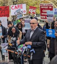 Michael Mulgrew, president of the United Federation of Teachers, at a rally outside City Hall on Nov. 17 blasted Mayor Eric Adams proposed budget cuts which will slash nearly $1 billion from the DOE over the next two years. Photo: Brian Berger