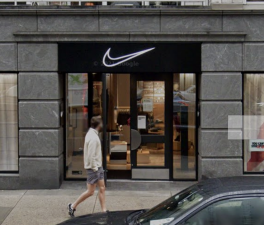 A man walks past the Nike Well Collective in October 2020 when it was still expected to be an upscale shopping experience at East 67th Street and Third Avenue.