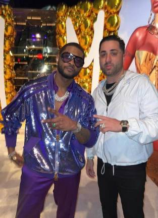 Benny the Jeweler posing with the R&amp;B superstar Usher.