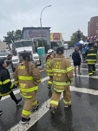 Many don firefighters turnout gear with the name of a fallen firefighter on the back as they retrace the steps of Stephen Siller’s last run through the Hugh L. Carey/Brooklyn Battery Tunnel into the South Tower on 9-11.