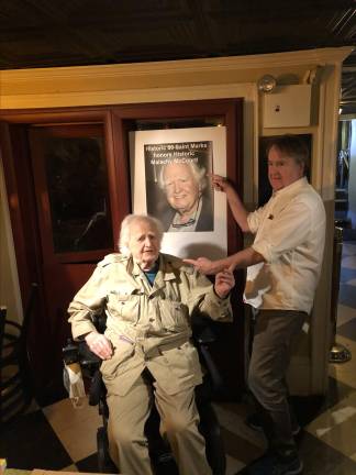 John McDonagh, known as New York’s most literary cab driver, is seen here, (standing) at a ceremony at Theater 80 in the East Village that honored Malachy McCourt, his longtime co-host on the WBAI Sunday morning show Radio Free Erin. McCourt passed away in 2024. McDonagh is hosting a one-man play on March 15 at the Center of Ethical Culture based on 40 years driving a NYC cab.