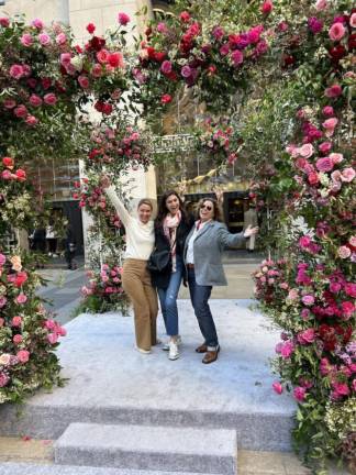 Megan Ouderkirk, Stef Spina and Vanessa Brown said they had just come Christie’s where they viewed former Vogue editor Andre Leon Tolley’s exhibit before heading to the floral arch. Photo: Jill Brooke