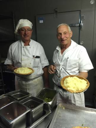 Executive Chef Keith Eldridge (left) and Eli Zabar about to pop a batch of fresh quiches into the oven at the Vinegar Factory. Photo: David Williams