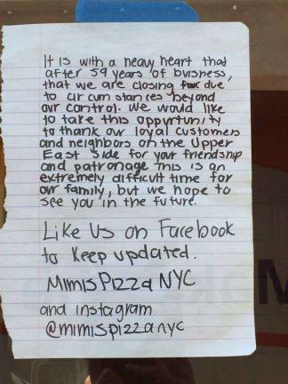 Mimi's owners posted this message on the pizza restaurant's window. Photo: Silas White