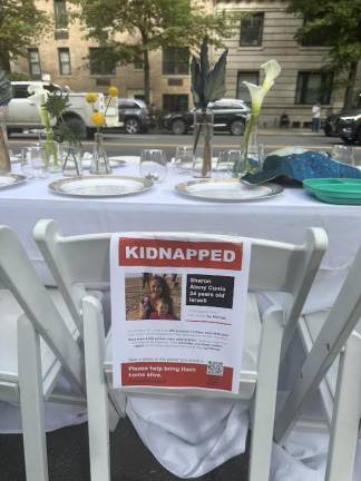 Empty chair for Mother, Sharon Alony Cunio at the Shabbat table.