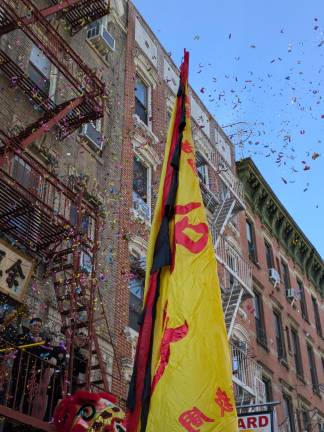 Confetti falls on Bayard Street.