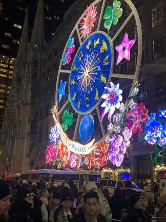 <b>A giant pinwheel lit up the Saks building on Fifth Ave. in a joint display with Christian Dior.</b> Photo: Keith J. Kelly