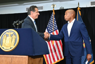 Governor Cuomo holds a press conference about gun violence with Brooklyn Borough President Eric Adams, back on July 14, 2021 a few months before Adams was elected mayor, the job Cuomo now wants to take from him.