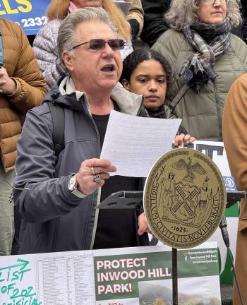 Local advocate and founder of Save Inwood Hill Park, Massimo Strino, speaks during the Feb. 27 rally on the steps of City Hall, Beyond Plastic’s Nyah Estevez pictured behind. “There is no place for plastic grass in our parks,” Strino said.