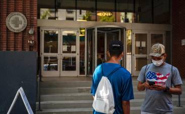 Migrants from Venezuela in 2022 outside the facility that now houses the NYC Asylum Seeker Application Help Center.