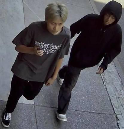 Suspected thugs, unmasked. At left, the bottle blonde, who wore a “sheisty” mask during the attack, has been arrested. At right, his hoodie-wearing accomplice remains at large.