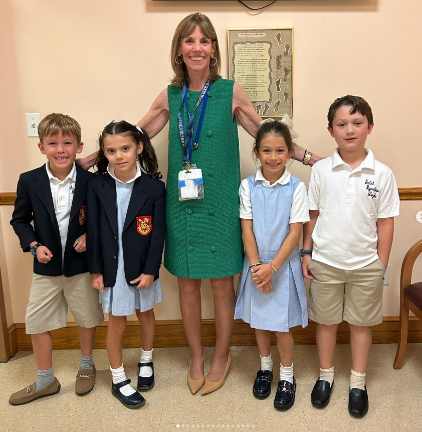 Mary Larkin, Head of School at the St. Ignatius Loyola School with some of the students. The school has won three Blue Ribbon awards from the Department of Education since her arrival as the school’s top person.