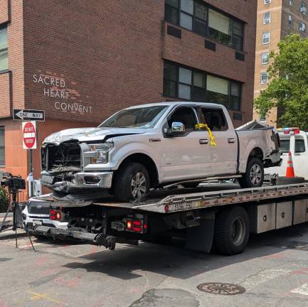 Daniel Hyden’s truck being removed by NYPD Fleet Services. Though pointed the wrong way on one way Water Street, the NYPD flatbed will soon back up and drive away up Jackson Street.