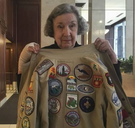 Irma Cohen, 90, shows off a jacket covered in the patches she&#x2019;s collected while crisscrossing the globe. Photo: Megan Conn