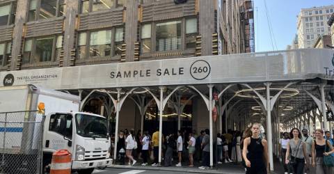 COS sample sale attracts several blocks full of patient customers to the popular Chelsea Outlet