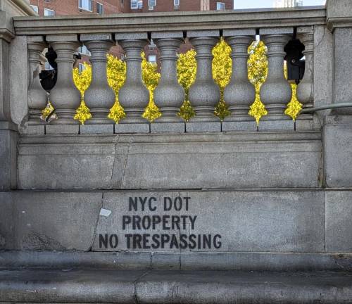 Manhattan Bridge Plaza colonnade south side: NYC DOT PROPERTY NO TRESSPASSING, October 18, 2024.