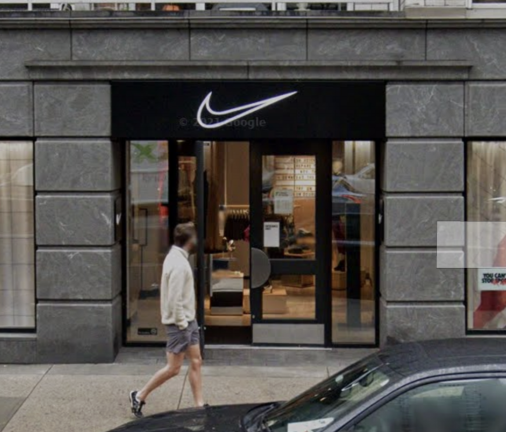 A man walks past the Nike Well Collective in October 2020 when it was still expected to be an upscale shopping experience at East 67th Street and Third Avenue.