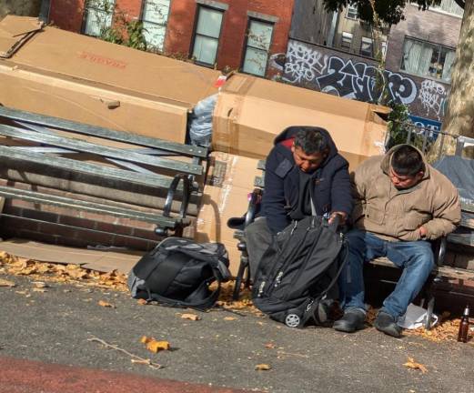 The east side of Sara D. Roosevelt Park, facing Chrystie Street. Note cardboard shelter and morning beer bottle.