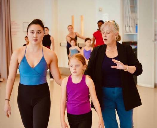 Lydia Johnson (right) with some of her dance troupe members.