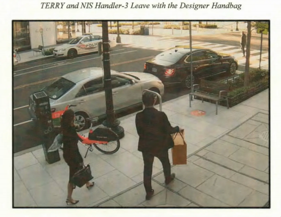 <b>The image above was included in Terry’s indictment, depicting her and a man the government claims is a South Korean intelligence officer (dubbed her “handler”) leaving a luxury store with a new designer bag as a reward for Terry’s espionage. </b>