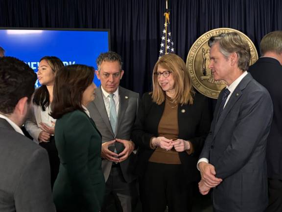 Local Manhattan political leaders including assembly members Tony Simone (to the right of Hochul) and Linda Rosenthal and NYS Senator Brad Hoylman-Sigal gathered around Gov. Kathy Hochul on the day she unveiled that she was “unpausing” the congestion pricing plan, but lowering the maximum toll charged to $9 from its original $15. Two federal judges recently refused to issue preliminary injunctions to halt its start-up on Jan. 5.