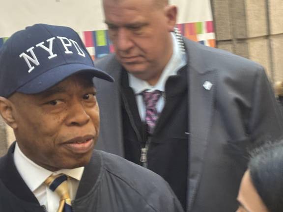 Mayor Eric Adams calls reporters “liars,” as he leaves a press conference at Bellevue Hospital Feb. 18 where an NYPD office had been taken after getting shot. He refused to answer questions about his embattled administration which saw four deputy mayor’s resign. Calls are growing for him to resign.