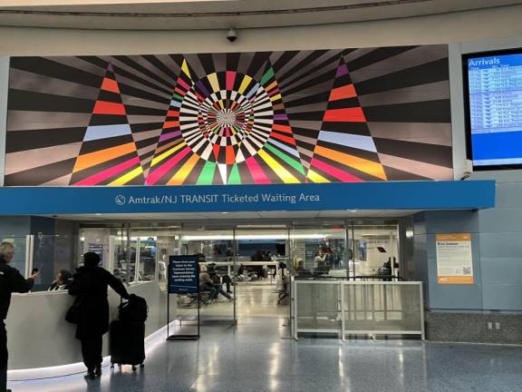 As the largest and centerpiece of the newest art in Penn Station, this part of Rico Gatson’s work will stop you in your tracks. Combining abstract math, tight jazz, spirituality, and spaces working together, defined by vibrant colors and black space, this panel should be a must-see for passengers and pedestrians as they stroll through the upper level rotunda.