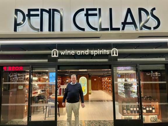 Owner Bruce Caulfield stands at the front of his brand new Penn Cellars wine and spirits store in Penn Station Long Island Rail Road Concourse which opened on December 23, 2024.