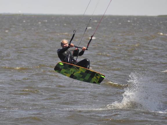 Ballet, shown here kitesurfing in 2013, partakes in numerous water sports, including fishing, sailing, windsurfing, stand-up paddle boarding, and more.