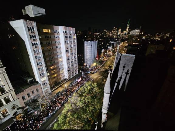 The parade as seen from the Jefferson Market Library clock tower. More than 100,000 people were estimated to have packed Sixth Ave. in Greenwich Village for the 51st annual Halloween parade.