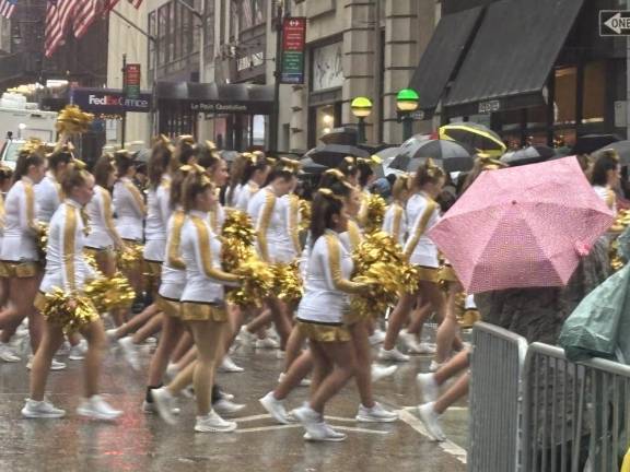 Marching bands are a big part of the parade but the pom poms were a little wet this year.