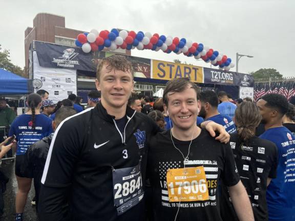 Tunnel-to-Towers participants from Manhattan, Eamon Kelly (left) and Sean Reilly, meet up at the start of the run.