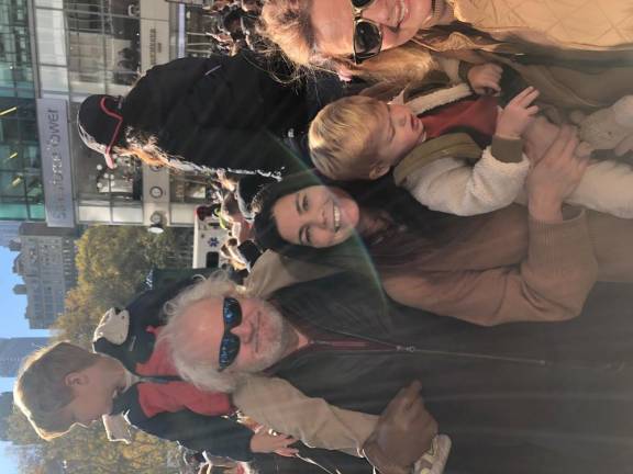 <b>Spectators come from near and far. Joe Johnson (black jacket, sunglasses) said he and wife Colleen (far right) were in town from New Orleans to celebrate their 35th wedding anniversary with grandson Harrison (on shoulders) daughter Victoria (center) and grandson Anders (being held by Victoria).</b> Photo: Keith J. Kelly