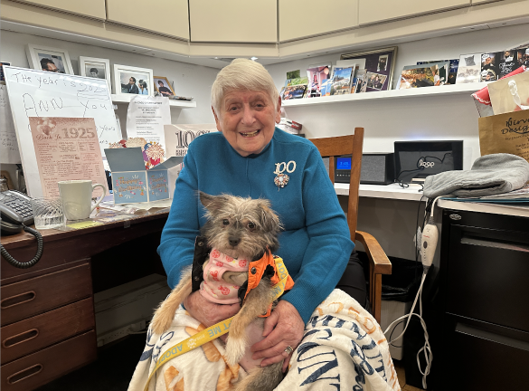 Bideawee pup, Bacon Bit, joins Anne Kelemen for her special day.