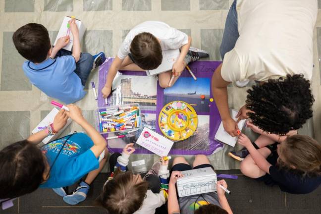 School kids learning about New York City at the Museum of the City ofNew York.