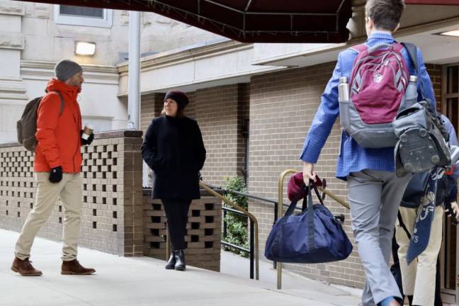 Kim Smith, Xavier High School headmaster, greets students and faculty at the school entrance on a cold March morning. Photo courtesy of Xavier High School