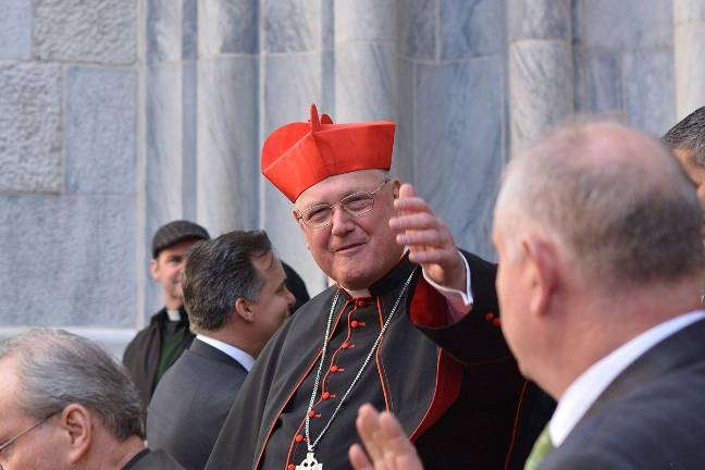 Cardinal Timothy Dolan kicks off the day with a Mass at St. Patrick’s Cathedral. He’s seen here greeting marchers and the grand marshal at the 2024 St. Patrick’s Day parade.