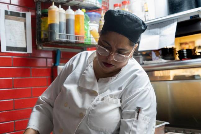 <b>Nupur Arora prepping her meal kits in Mughlai’s kitchen.</b> Photo: Priyanka Rajput