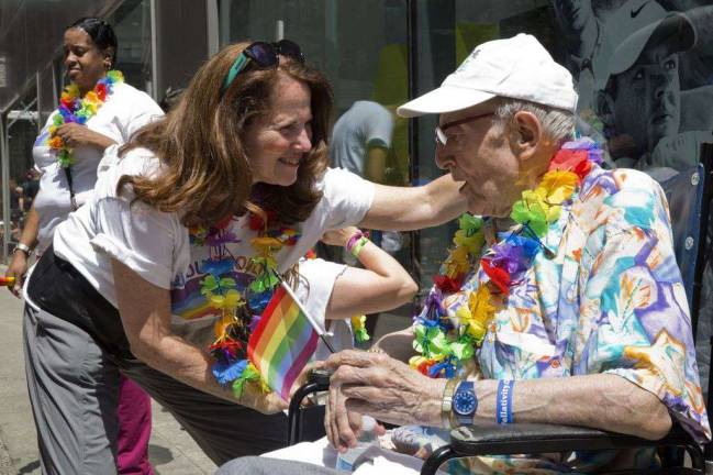 The New Jewish Home CEO Audrey Weiner and resident Richard Morse prepare for NYC Pride March.