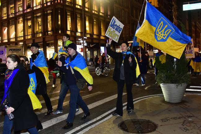 Many of the demonstrators marching down Broadway on March 4 wrapped themselves in capes with the colors of the Ukrainian flag.