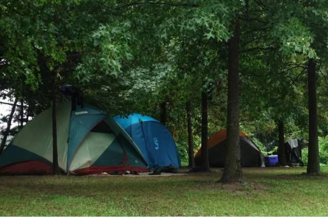 A group of homeless migrants set up tents near the Randalls Island temporary shelter, Aug. 7, 2024.