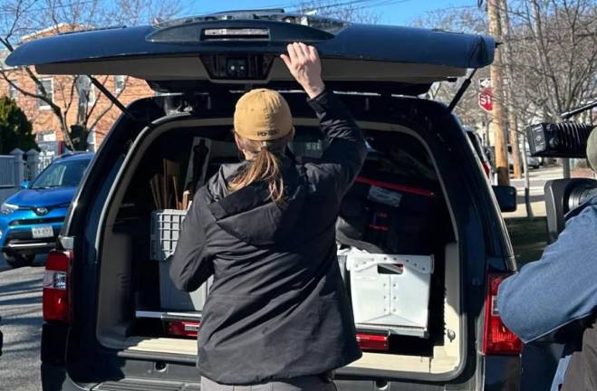 Federal agents load material taken from the home Winnie Greco, the director of Asian Affairs in the Adams Administration, on Feb. 29. Photo: Yoav Gonen/THE CITY