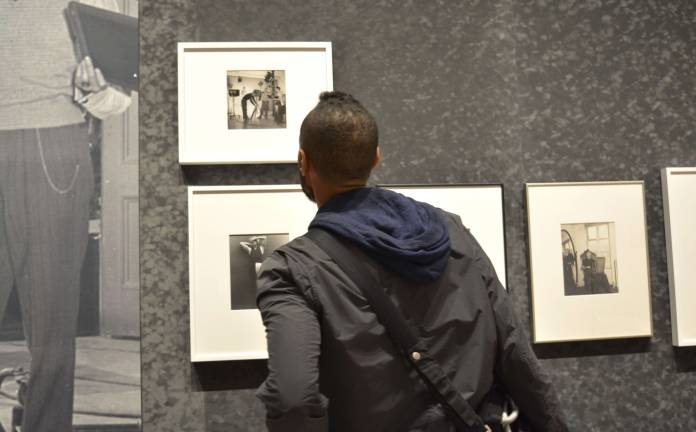 Artist Basil Rodriguez explored both floors of the Gay Gotham exhibit at the Museum of the City of New York on Oct. 6. Although Rodriguez missed the opening panel, he found the large variety of homoerotic art in the exhibit thought-provoking. Photo: Diamond Naga Siu