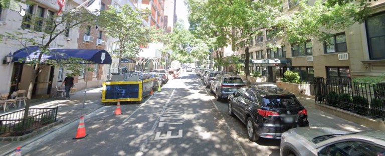 E. 77th St. leading up to The Birch Wathen Lenox School, pictured on left with blue awning. The school hopes to partially close the street for student playspace from 9 a.m. to 2 p.m. everyday, drawing local ire.