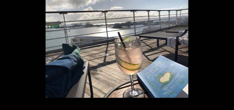 Enjoying a novel and a Cunard Spritz in Port of Le Havre.