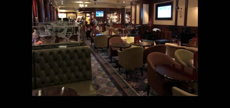 The Golden Lion Pub features fish &amp; chips and Cunard ale.